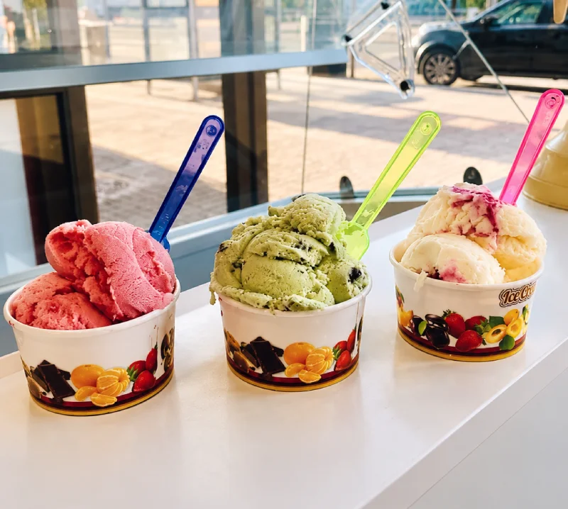 Assorted ice cream tubs with spoons at Night Star in Cambuslang