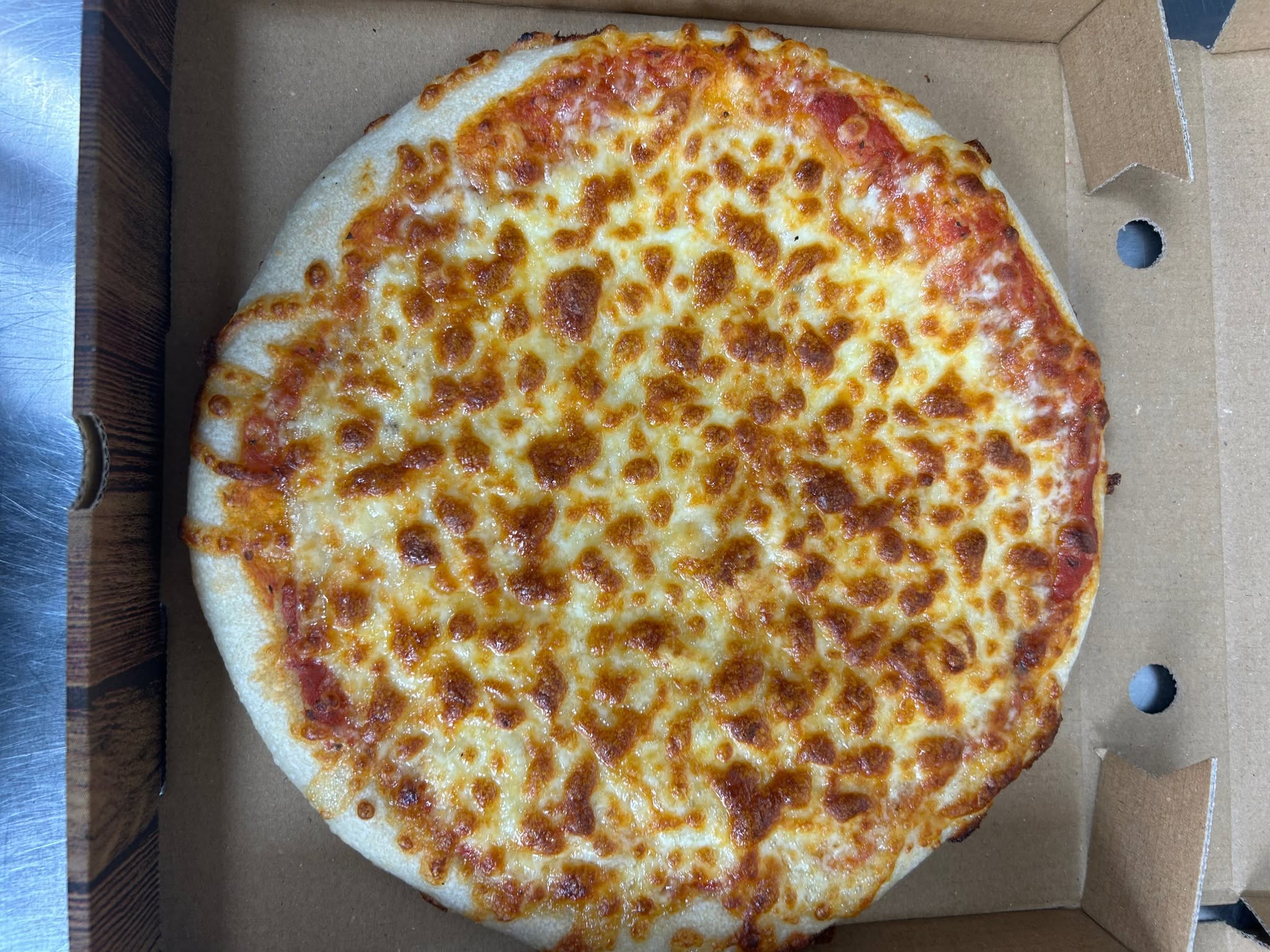 Freshly baked pizza in a box from Night Star in Cambuslang